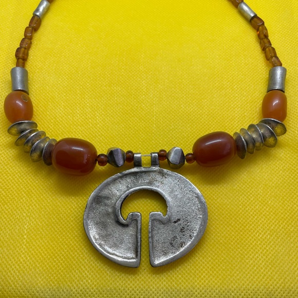 This amber and silver necklace measures 91/2 inches. - Picture 2 of 3